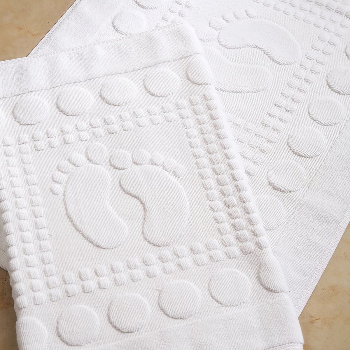 Tapis de salle de bain en coton, relief petits pieds