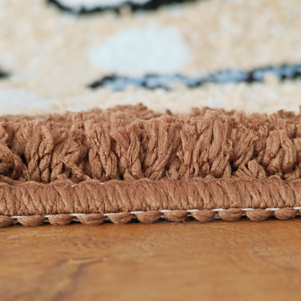 Tapis de salle de bain coquillages tuftés en relief