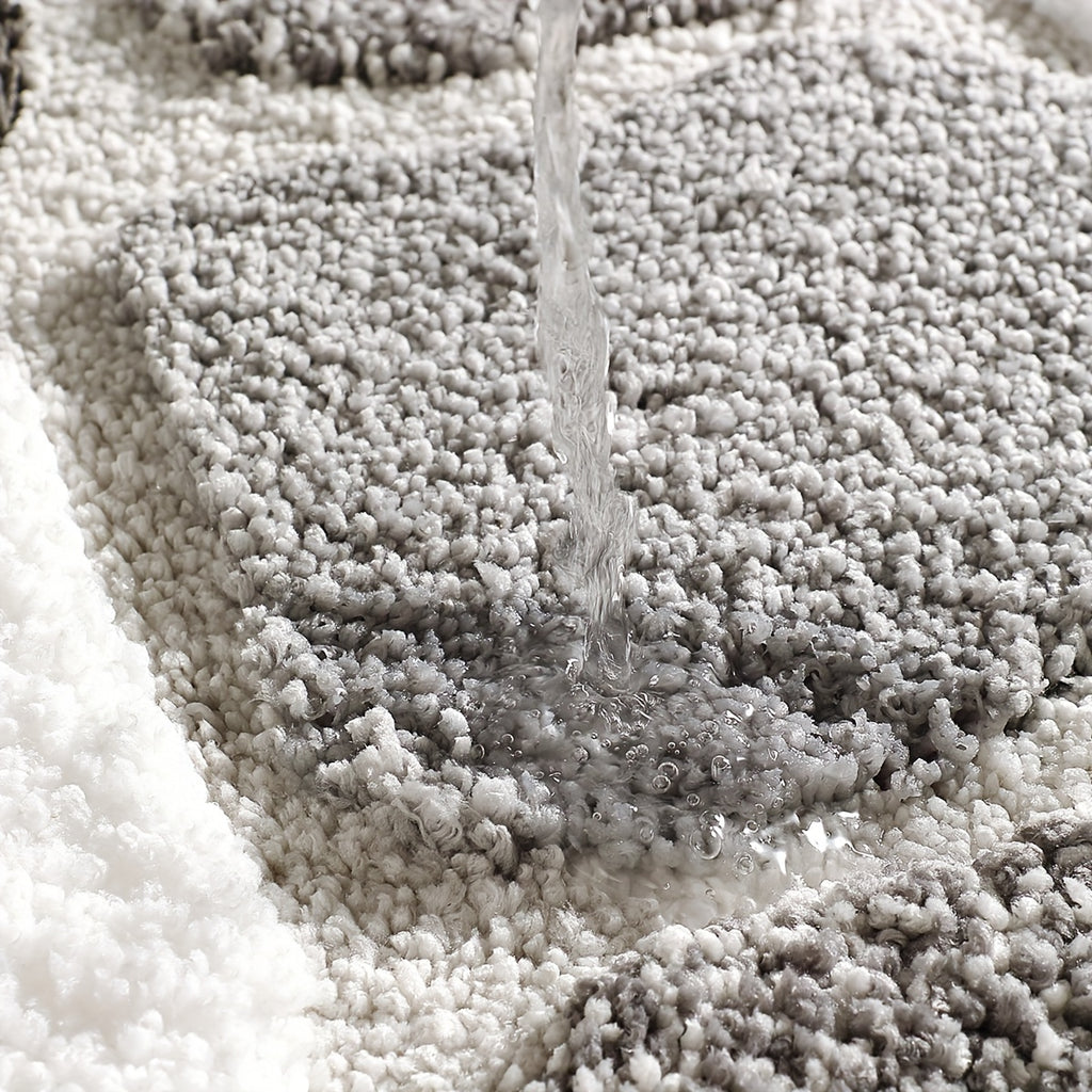 Tapis de salle de bain effet galets, relief tufté épais